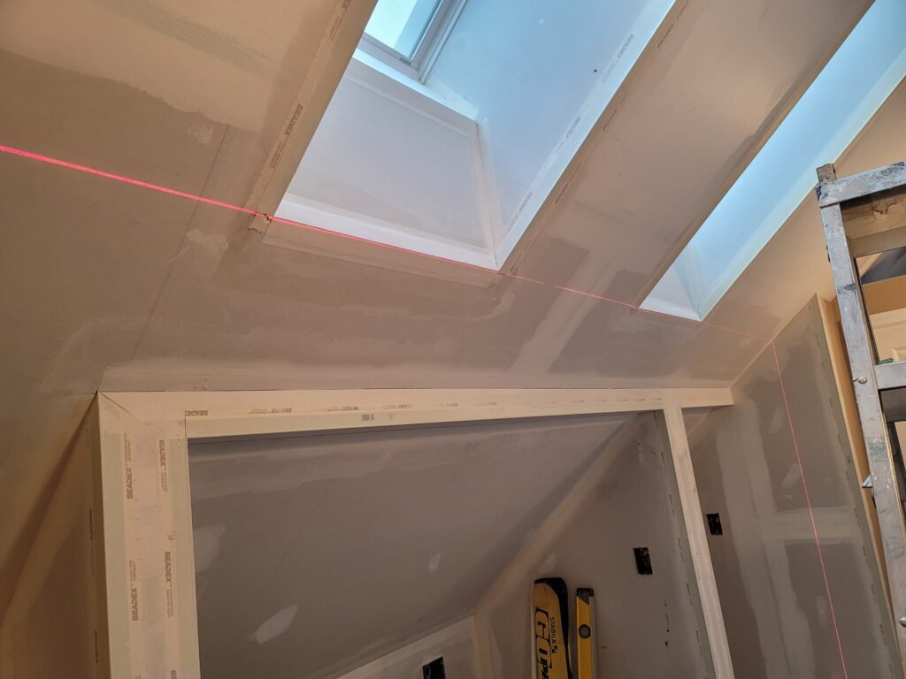 Drywall installation using laser guidance